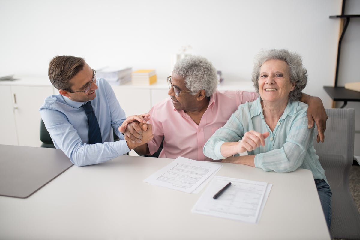 A Be Well Health consultant meeting with clients